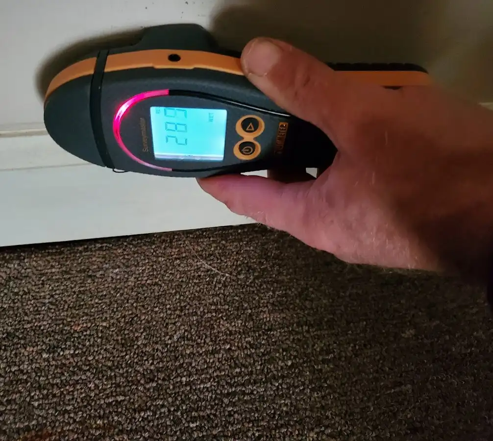 Moisture detection at baseboard during Storm Damage Restoration in Huber Heights